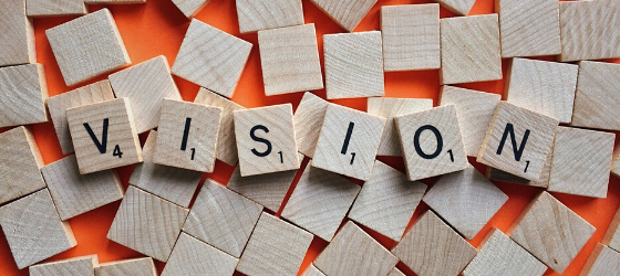 numberes scrabble squares with letters spell the word vision